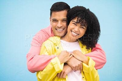 Buy stock photo Happy people, smile and hug in portrait with couple in love, commitment isolated on blue background. Interracial relationship mockup, commitment and together in studio with black woman, man and trust