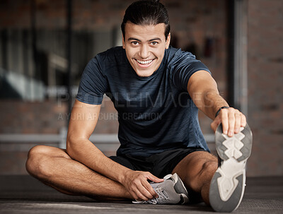 Buy stock photo Portrait, fitness and stretching with a man athlete in gym getting ready for his workout routine. Exercise, health and warm up with a handsome young male training in a performance center for wellness