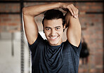 Arm stretch, gym fitness and portrait of a man ready for exercise, training and wellness workout. Happy, smile and excited young person about to start sport health by stretching for sports alone