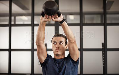 Buy stock photo Man, kettlebell and gym fitness of a person training with focus mindset in a health studio. Power train, weight workout and wellness target goal of an athlete doing cardio and arm challenge breathing