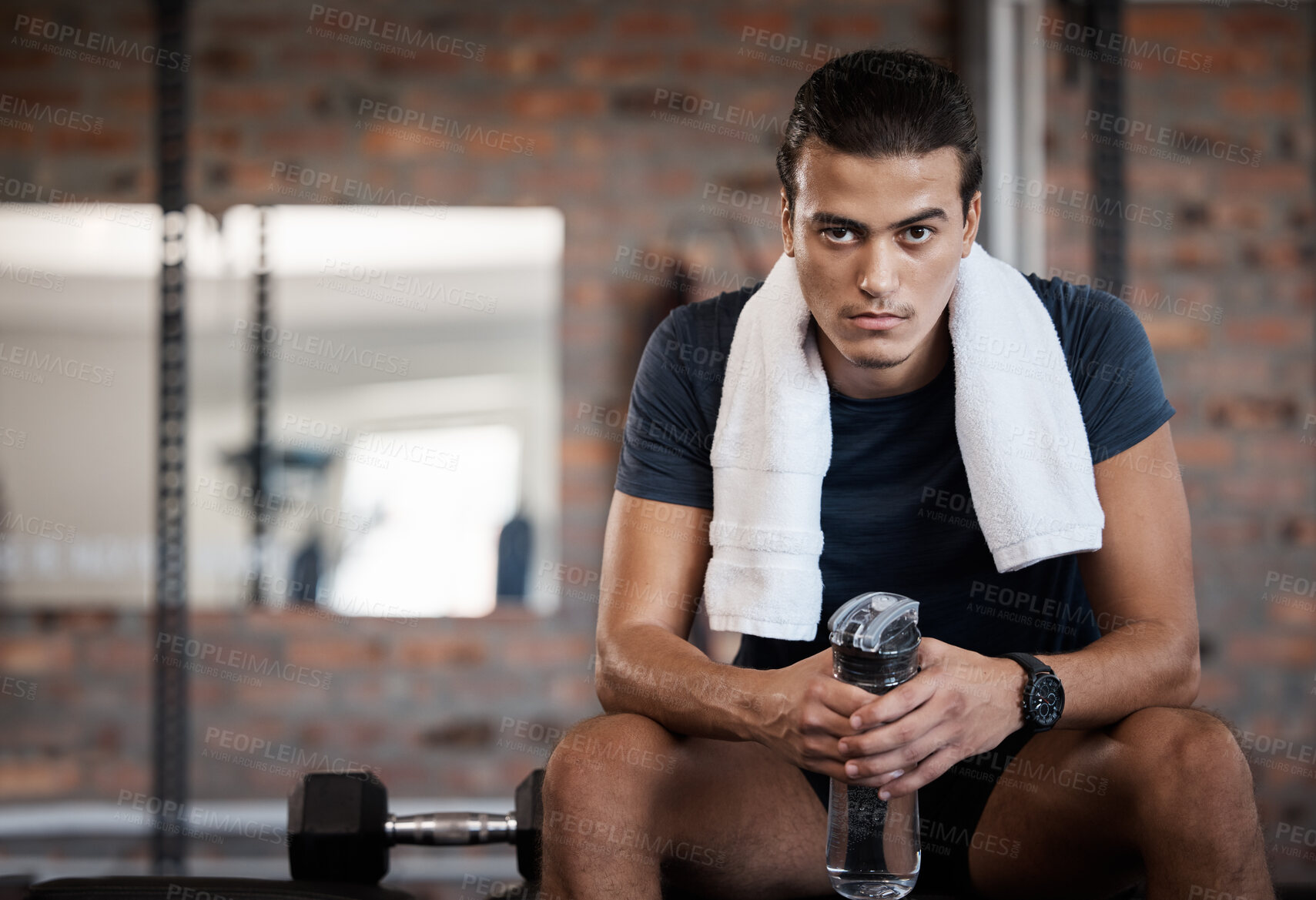 Buy stock photo Portrait, man and water bottle in gym for break, rest and energy to focus after exercise with towel. Sports man, bodybuilder and athlete relax after workout, training and wellness in fitness club 
