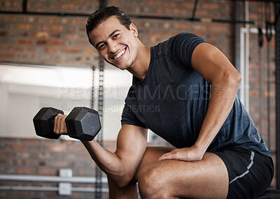 Buy stock photo Portrait, fitness and dumbbell with a sports man training in a gym for strong or healthy muscles. Happy. exercise and weightlifting with a male athlete or bodybuilder in a health club for a workout