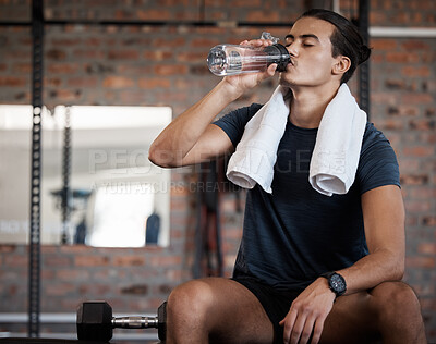 Buy stock photo Fitness, relax and drinking water with man in gym for health, exercise and cardio endurance. Wellness, weightlifting or training with body builder on break in sports center for stamina, detox or diet