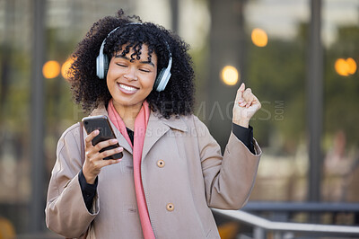 Buy stock photo Happy woman listening to music in city, dancing with energy or mental health podcast for travel. Urban student in headphones, smartphone or 5g audio technology, streaming app on her way to university
