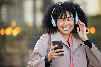 Buy stock photo Black woman, texting and phone in city with headphones, smile and social media chat. Gen z businesswoman, smartphone and online dating with music, podcast or digital networking app in metro