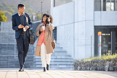 Buy stock photo Businessman, black woman and walking with coffee in city for planning, strategy or social discussion by office building. Teamwork, finance job and friends with discussion in urban metro for success