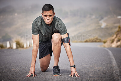 Runner, start and man race in road for cardio exercise, workout and urban fitness on mountains. Sports person, athlete and guy ready to begin running in street, sprint and focus on marathon training