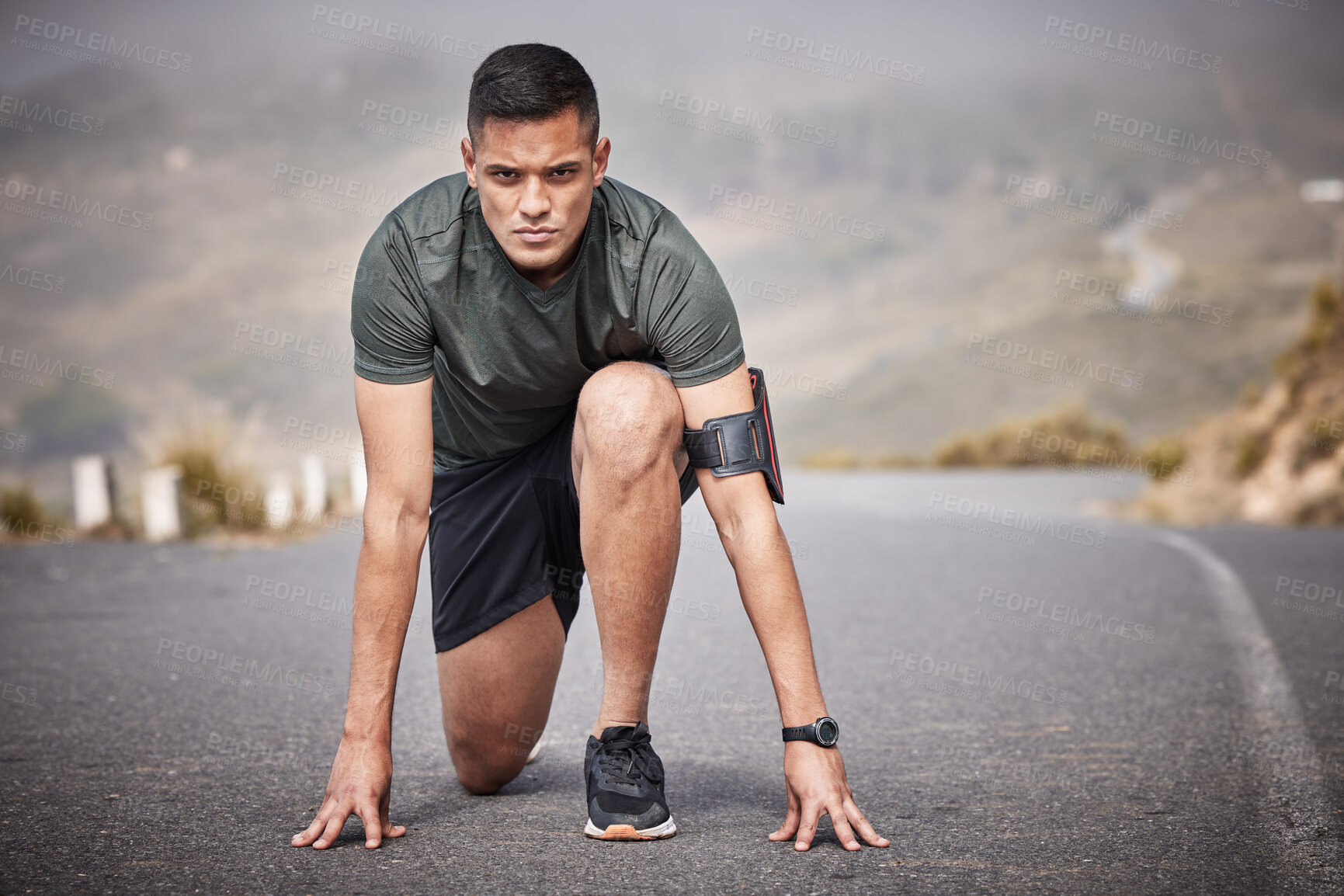 Buy stock photo Runner, start and man race in road for cardio exercise, workout and urban fitness on mountains. Sports person, athlete and guy ready to begin running in street, sprint and focus on marathon training 