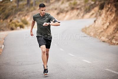 Buy stock photo Smart watch, man and running in road for exercise, cardio workout and marathon training in nature. Stopwatch, sports runner and athlete check time, heart rate or monitor body progress of health goals