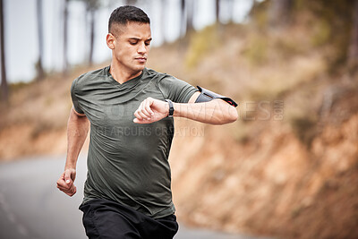 Buy stock photo Fitness, smartwatch or man running for exercise, cardio training or workout in nature tracking health stats. Wellness, runner or sports athlete monitoring speed performance, heart rate or progress