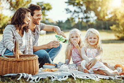 Buy stock photo Picnic, park and and family of parents, children and happy people on garden grass in sunshine. Kids, mom and dad smile with food on field, nature and summer vacation to relax on lawn with happiness
