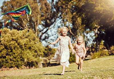 Buy stock photo Kite, running and children running in an outdoor park with summer fun and smile. Nature, kids vacation and happiness of kids ind sunshine with freedom and smiling bonding together on green grass