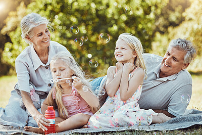 Buy stock photo Children, seniors or bonding with bubbles in park, home nature picnic or house garden in fun, silly or goofy activity. Smile, happy or retirement elderly with kids in family social and soap water toy