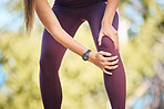 Knee pain, woman runner and nature park path for fitness, health or rest by trees to massage legs. Outdoor training, running and relax in forest for emergency joint injury, anatomy problem or workout