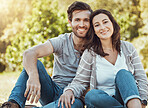 Couple, park and portrait of young people with love, care and bonding together in nature. Lens flare, smile and happy woman and man in sunshine feeling happiness from engagement and commitment