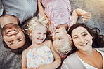 Happy family, portrait and children with mom and father relaxing and smiling from top view from a park outdoors. Kids, overhead and excited parents with love, care and happiness bonding