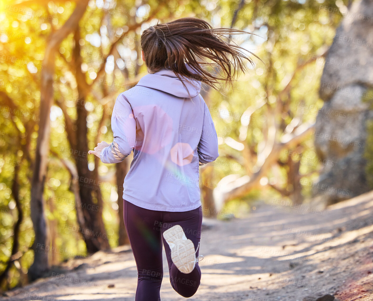 Buy stock photo Back, woman and running in nature, training and fitness for wellness, balance and healthy lifestyle. Female athlete, lady and runner in forest, practice or exercise for stress relief or summer break 