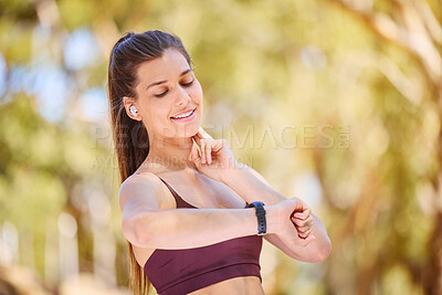 Buy stock photo Woman runner, smartwatch and heart rate in nature park for fitness, health or wellness by trees. Outdoor training, running and digital tech in forest for anatomy, goal or healthcare at hiking workout