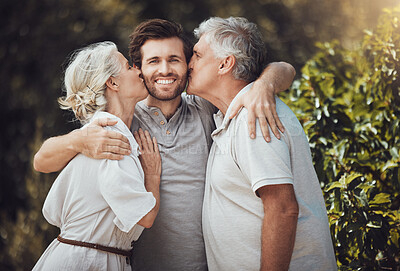 Buy stock photo Happy family, portrait and bonding cheek kiss from senior parents, mother or father in nature park or home backyard. Smile, man and retirement elderly in hug, love or support embrace in house garden
