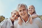 Grandparents, grandchild and portrait in a park for family, love and bonding in nature on blue sky background. Face, seniors and girl relax in a garden, happy and smile while having fun in America