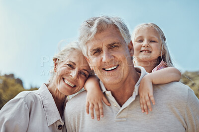Buy stock photo Grandparents, grandchild and portrait in a park for family, love and bonding in nature on blue sky background. Face, seniors and girl relax in a garden, happy and smile while having fun in America