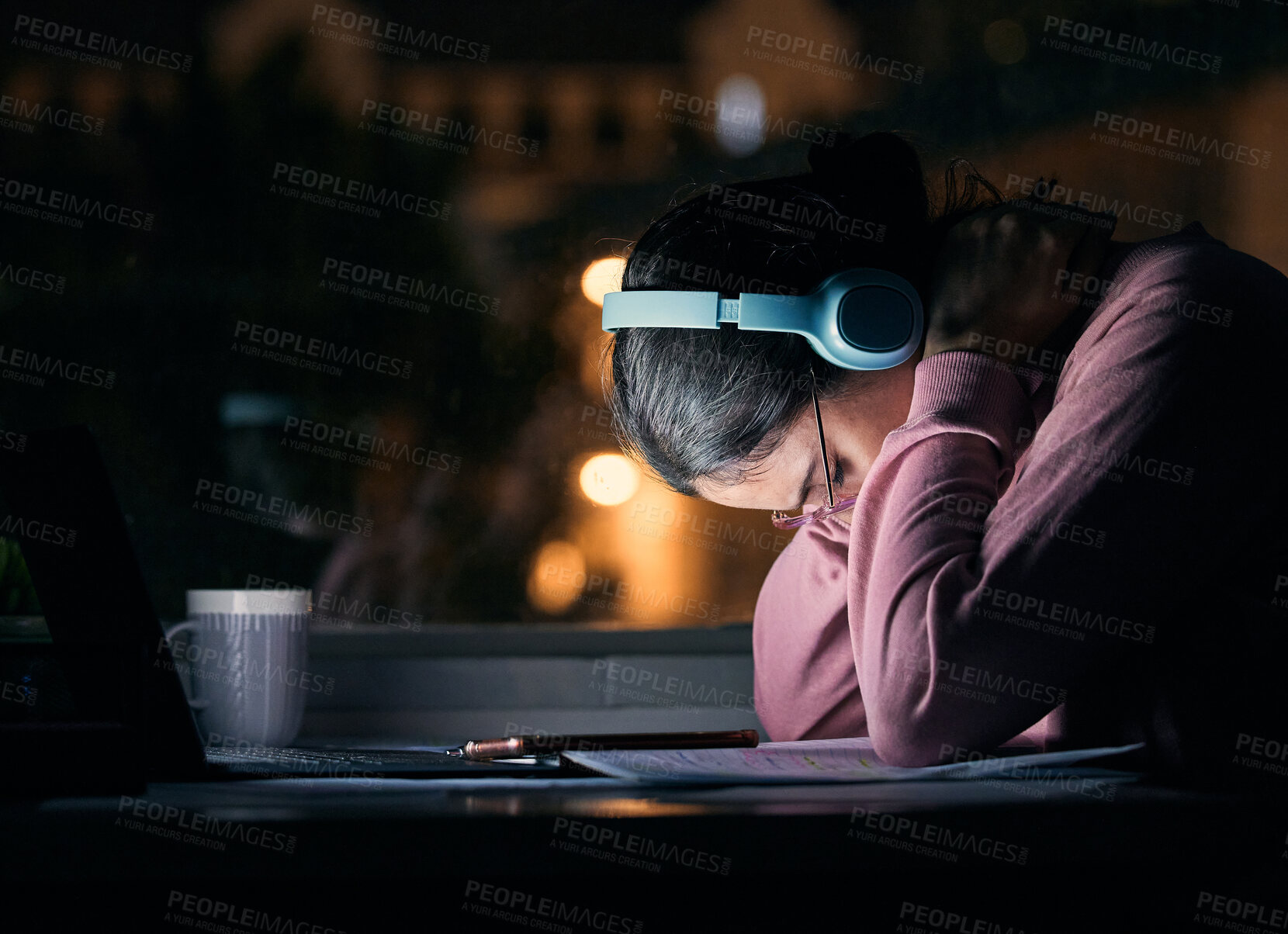 Buy stock photo Headache, tired and stress student at night study, learning and university depression, mental health or burnout. Depressed, tired and anxiety college woman, headphones for exam planning in dark room