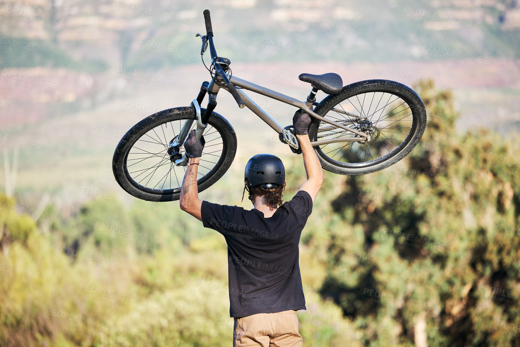 Buy stock photo Bicycle, athlete and outdoor and sports athlete with fitness and cycling sport on mountains. Energy, moving speed and freedom with a bike in the air doing a fast road race with trees and helmet