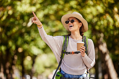 Buy stock photo Woman, backpack or pointing in nature travel, sightseeing park or bird watching adventure in trees forest or Canada woods. Smile, happy tourist and showing hand gesture in hiking location with coffee