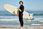 Man, surfer and surfboard at the beach for training exercise or fitness workout in the outdoors. Portrait of happy sports professional with smile showing hand gesture for hang loose ready for surfing