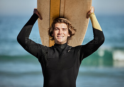 Fitness, beach and portrait of a surfer with a surfboard for exercise, fun and adventure on vacation. Water sports, travel and man athlete surfing by the ocean on a tropical holiday in Australia.