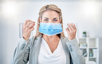 Woman, office portrait and put on mask for covid 19 safety, health and stop spread in workplace. Corporate leader, manager and wellness in workspace with blurred background, ppe and self care at job