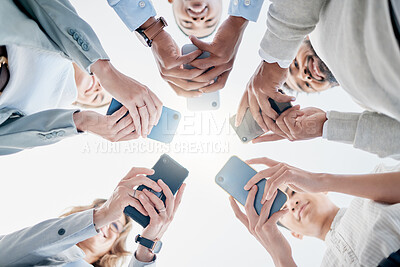 Buy stock photo Phone in hands, technology and business people, collaboration and communication in team for company. Chat, internet and community diversity, networking and typing in teamwork circle from below
