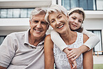 Portrait, girl and grandparents relax in real estate, new home and backyard, hug and happy while bonding. Face, grandchild and senior man and woman enjoy property, retirement and embrace in a garden