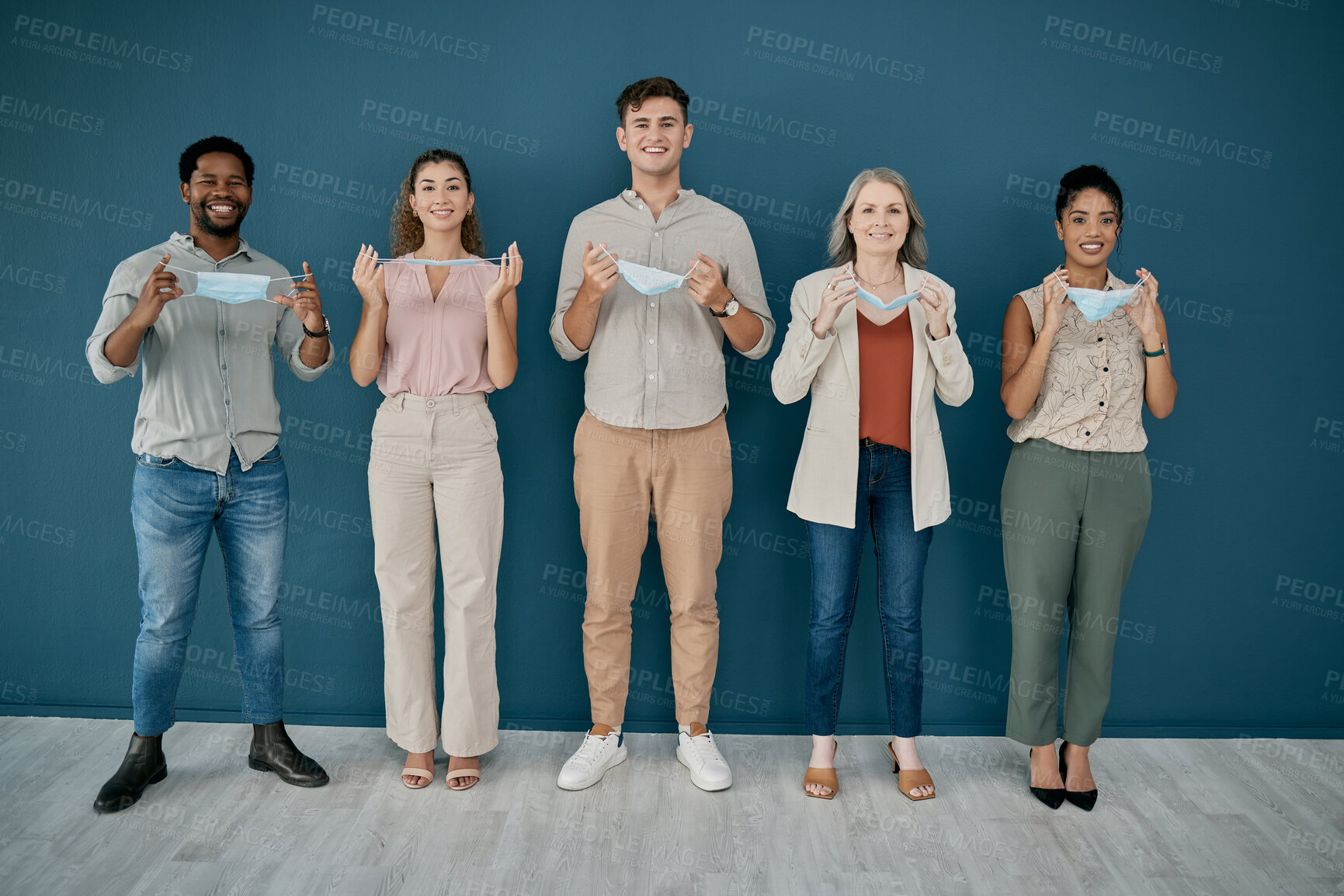 Buy stock photo Portrait, covid and business people take off mask in office, workplace or company. Health compliance, safety and group of happy employees, men and women with ppe to stop corona virus for wellness.