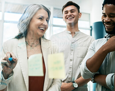 Buy stock photo Teamwork, collaboration and business people planning strategy on glass wall. Writing, sticky notes and female leader with group laughing at joke while brainstorming sales project ideas in workplace.