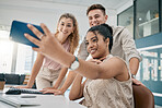 Mobile, selfie or friends with a business team taking a photograph for social media together in an office. Teamwork, collaboration or internet with a man and woman employee group posing for a picture
