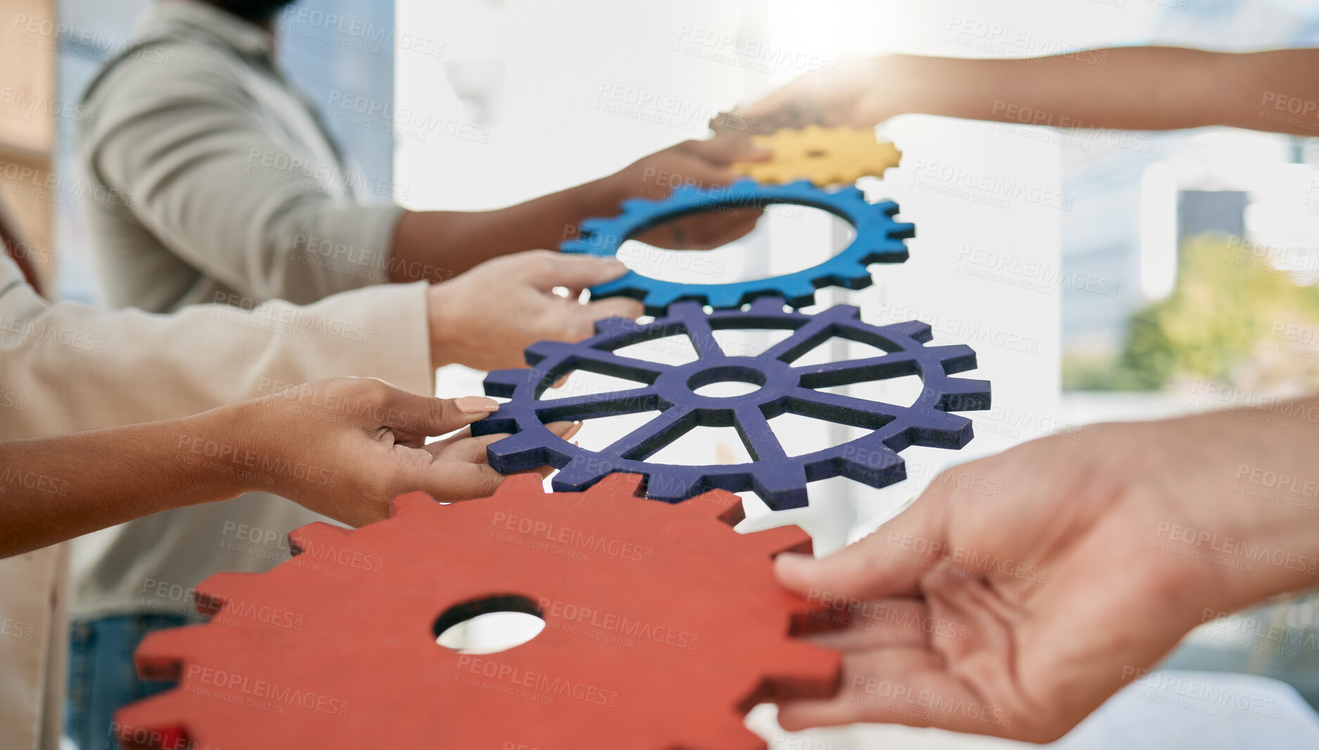 Buy stock photo Business people, toys and gears at job for teamwork, sign or symbol with solution, trust and solidarity. Corporate group, learning or development at team building exercise in city workplace for goals