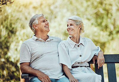Buy stock photo Love, retirement and couple on bench in park with smile, relax and bonding time in nature together. Romance, senior man and retired woman sitting in garden, happy people and romantic summer weekend.