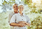 Senior couple hug in park, love and marriage portrait, retirement travel together with commitment outdoor. Old man, woman and care with trust and support, nature mockup and happiness in relationship