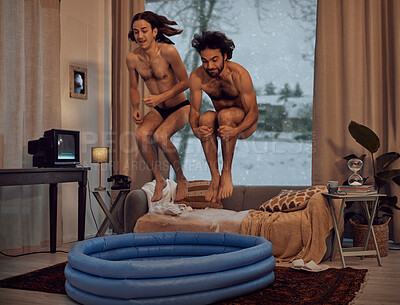 Buy stock photo Hipster, rebel and jump into inflatable pool in a lounge inside a retro home or house having fun and playing. Funny, snow and men dive together in the living room for a winter vacation or holiday