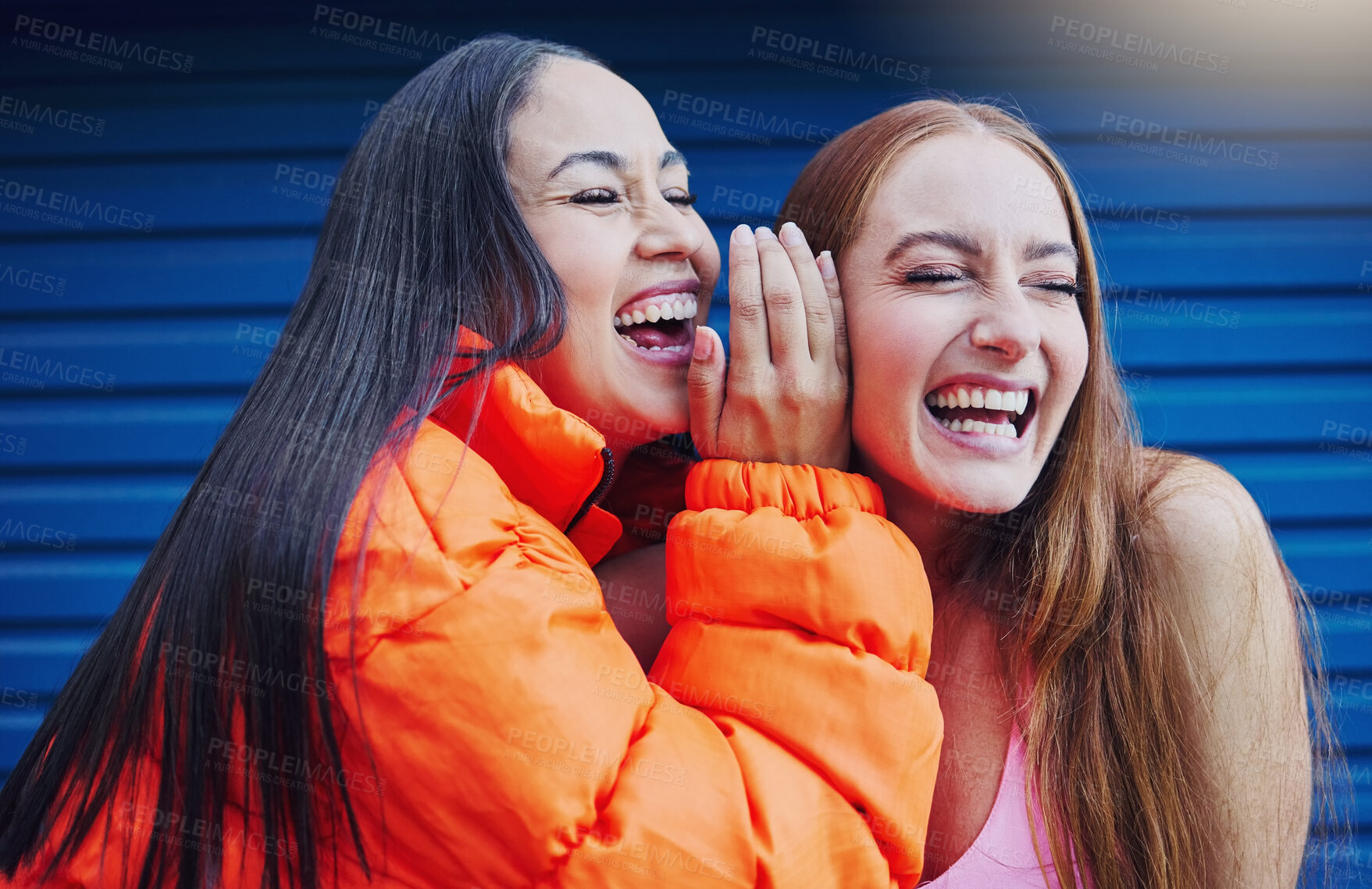 Buy stock photo Gossip, women talking and friends, laughing and reunion, bonding and blue wall background. Ladies, happy females and girls outdoor, quality time and conversation for funny, silly story and carefree