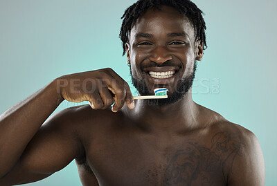 Buy stock photo Black man, face and toothbrush with smile in portrait, teeth whitening and cleaning mouth isolated on studio background. Fresh breath, beauty and hygiene with toothpaste, health and dental wellness