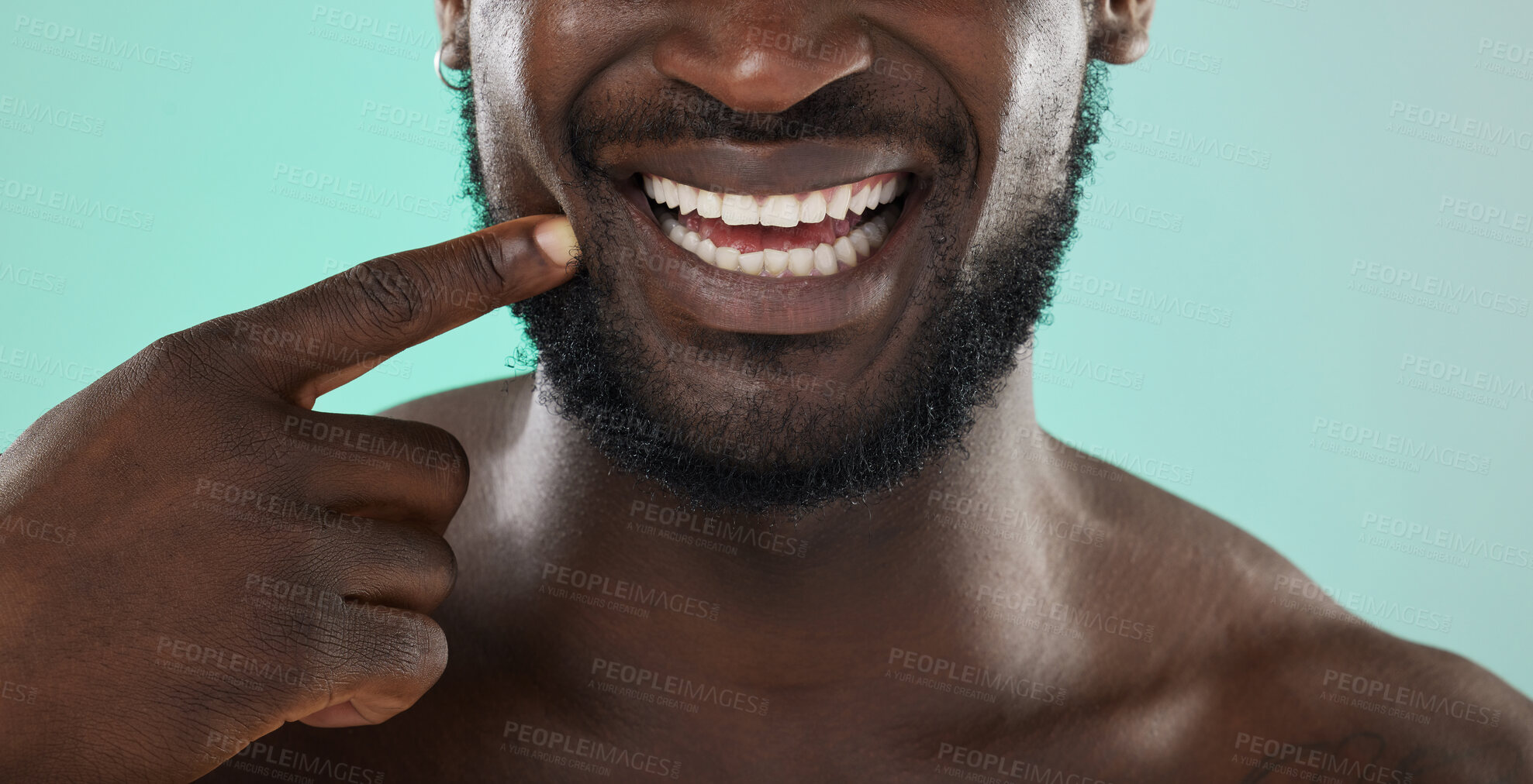 Buy stock photo Mouth, dental and teeth with a black man in studio on a blue background for oral hygiene at the dentist. Healthcare, insurance and whitening with a male touching his face or cheek for health