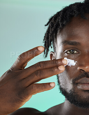 Buy stock photo Black man, hands and face for skincare moisturizer, lotion or cream for facial glow or treatment against studio background. African American male, person or guy applying creme for smooth or soft skin