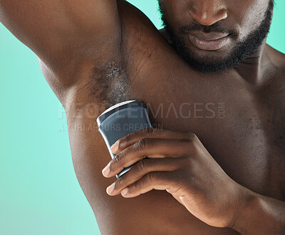 Buy stock photo Armpit hygiene and black man with deodorant and self care routine product of people with body zoom in studio. Health, wellness and cosmetic grooming of young person at isolated green background


