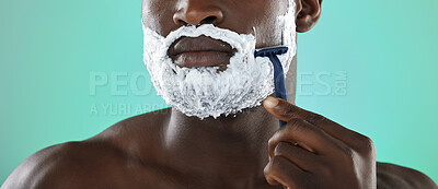 Buy stock photo Black man, shaving and cream in studio for skincare, razor and facial cosmetics for beauty by blue background. African gen z model, hair removal foam or shave for aesthetic, cleaning or face grooming