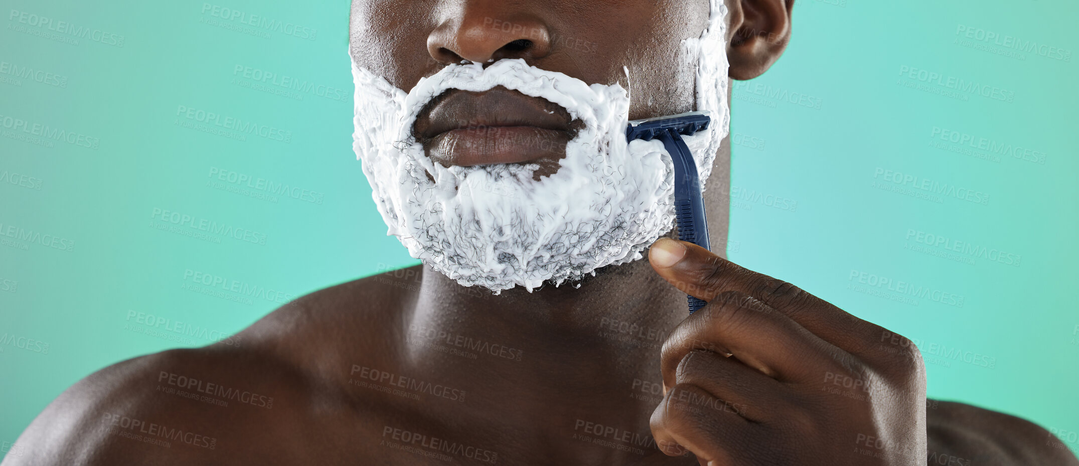 Buy stock photo Black man, shaving and cream in studio for skincare, razor and facial cosmetics for beauty by blue background. African gen z model, hair removal foam or shave for aesthetic, cleaning or face grooming