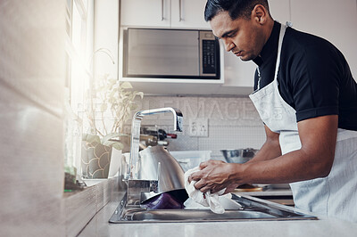 Buy stock photo Cleaning kitchen, washing dishes and a man in house, home or apartment to clean for safety from bacteria. Male cleaner person at sink with a cloth in hands for hygiene and a healthy lifestyle