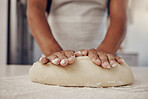 Chef hands and dough press for baking preparation work, production and process of man at culinary counter. Restaurant worker in professional kitchen preparing bread, cake or pizza recipe. 

