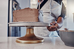 Hand, cake and cooking with a man chef working in a kitchen while preparing dessert for a party celebration. Food, chocolate and cherries with a male at work in a bakery to make gourmet confectionary